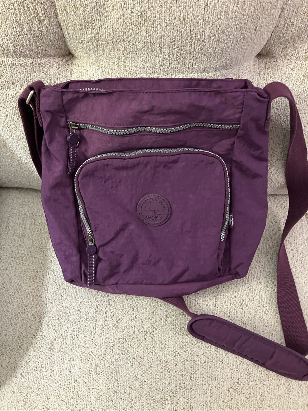 Purple Oakarbo Crossbody Bag With Adjustable Shoulder Strap